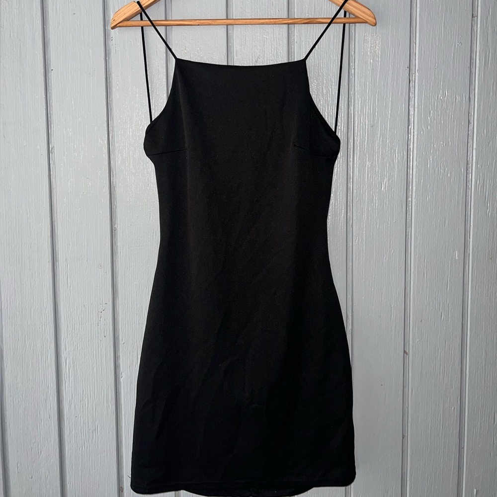 Black mini dress. Open back.